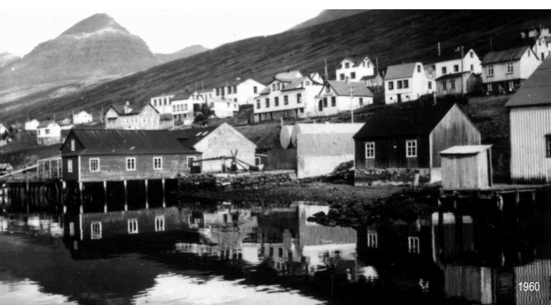Historic black and white photograph of Fáskrúðsfjörður harbour in 1960