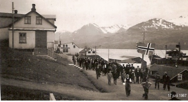 Historic photograph of a procession in Fáskrúðsfjörður in 1967